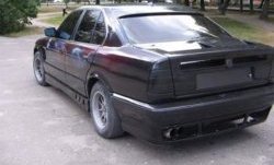 4 999 р. Накладка на задний бампер Rieger  BMW 5 серия  E34 (1988-1994)  с доставкой в г. Калуга. Увеличить фотографию 1