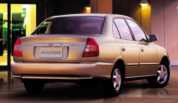 4 899 р. Задний бампер Стандартный Hyundai Accent седан ТагАЗ (2001-2012) (Неокрашенный)  с доставкой в г. Калуга. Увеличить фотографию 1
