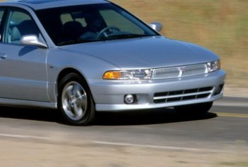 13 549 р. Передний бампер TYG (USA) Mitsubishi Galant 8  дорестайлинг седан (1996-1998) (Неокрашенный)  с доставкой в г. Калуга. Увеличить фотографию 1