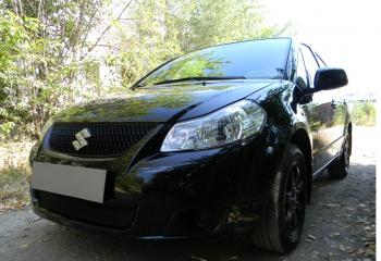 2 499 р. Защита радиатора Стрелка11 Стандарт  Suzuki SX4  GYC21S (2006-2012) дорестайлинг седан (черная)  с доставкой в г. Калуга. Увеличить фотографию 2